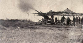 [100th Infantry: artillery firing]